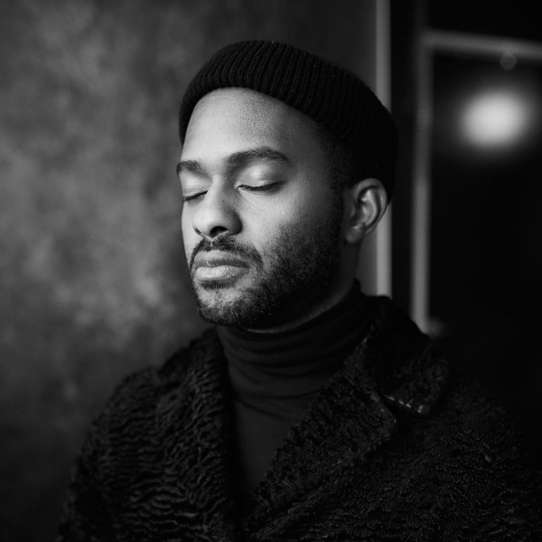 a black and white photo of a man with his eyes closed a black and white photo of a man with his eyes closed