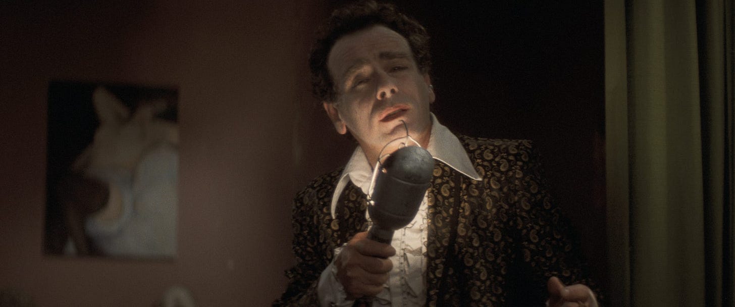 Blue Velvet | Still features Dean Stockwell singing into a lamp.