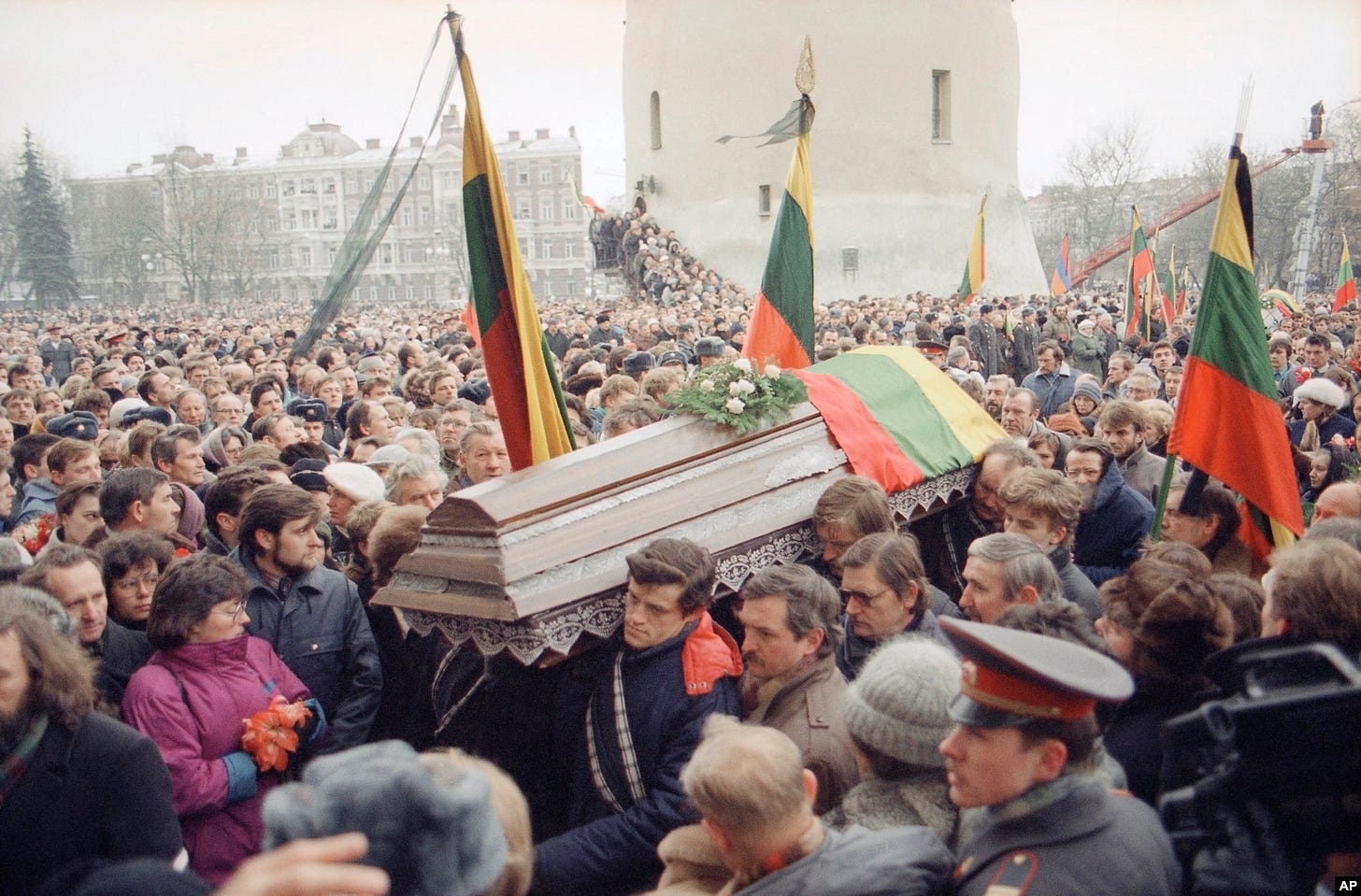 Huge crowds in Vilnius attend a funeral procession for 10 of the 14 people killed when Soviet troops stormed the Lithuanian broadcast center in January 1991. Huge crowds in Vilnius attend a funeral procession for 10 of the 14 people killed when Soviet troops stormed the Lithuanian broadcast center in January 1991.