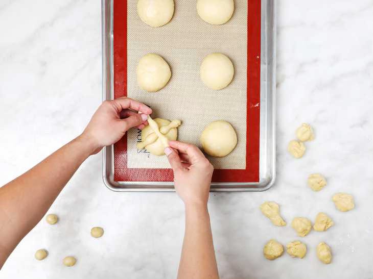 Placing Dough Strips on Top of Loaves