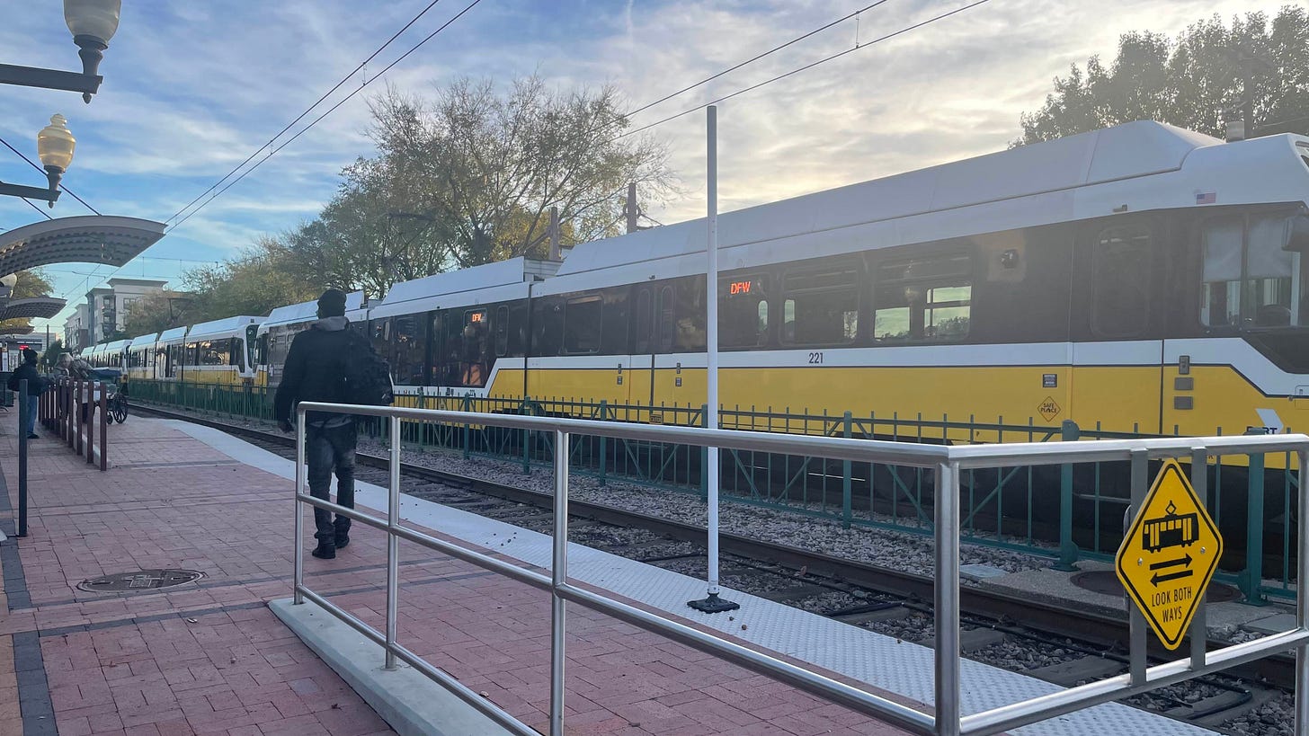 A three car DART light rail orange line at Downtown Plano Station A three car DART light rail orange line at Downtown Plano Station