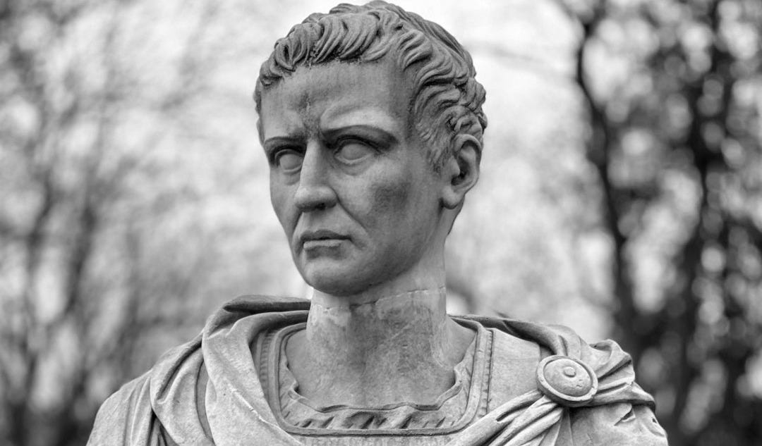 a bust of a man in a park