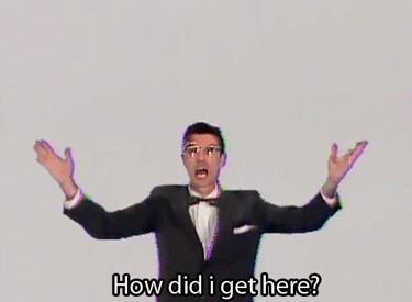 Talking Heads GIF "How Did I get Here" Man in tuxedo holding open arms 