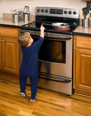 Hot Stove Danger Toddler Reaching Stock Photo - Download Image Now - iStock Hot Stove Danger Toddler Reaching Stock Photo - Download Image Now - iStock