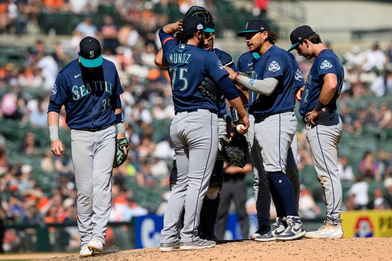 Mariners first baseman Josh Naylor, right, tries to calm down closer Andrés Muñoz in the ninth inning against the Tigers on Sunday in Detroit. (Lon Horwedel / The Associated Press) Mariners first baseman Josh Naylor, right, tries to calm down closer Andrés Muñoz in the ninth inning against the Tigers on Sunday in Detroit. (Lon Horwedel / The Associated Press)