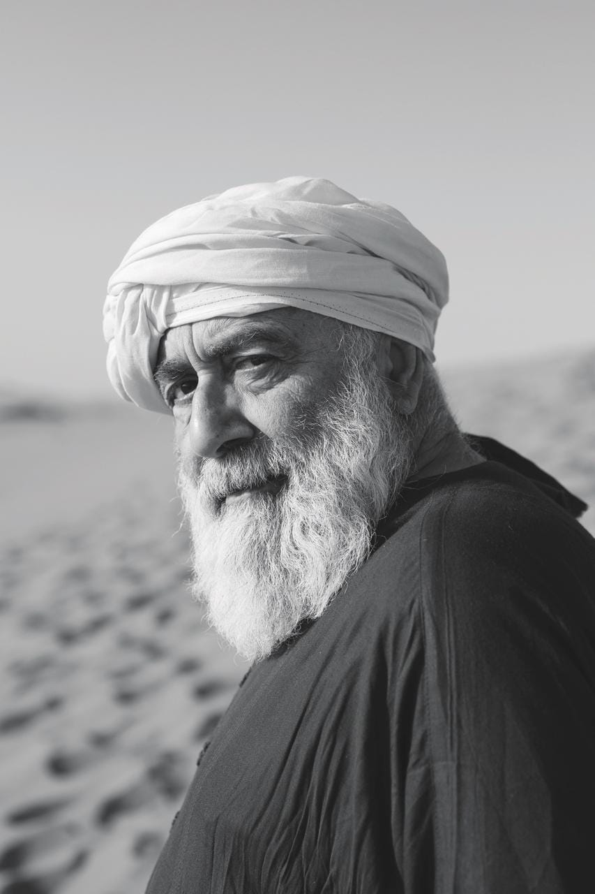 May be a black-and-white image of 1 person and camel
