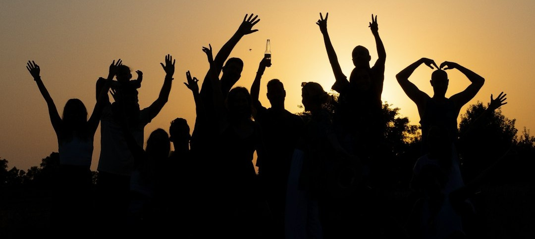 a group of people raising their hands
