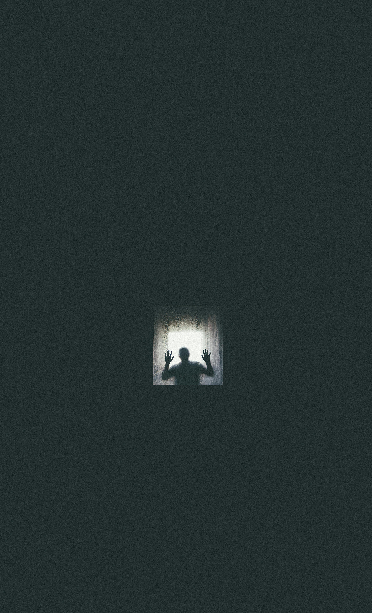A shadowy figure trapped in a dark room.