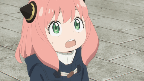 a girl with pink hair and green eyes is making a funny face a girl with pink hair and green eyes is making a funny face