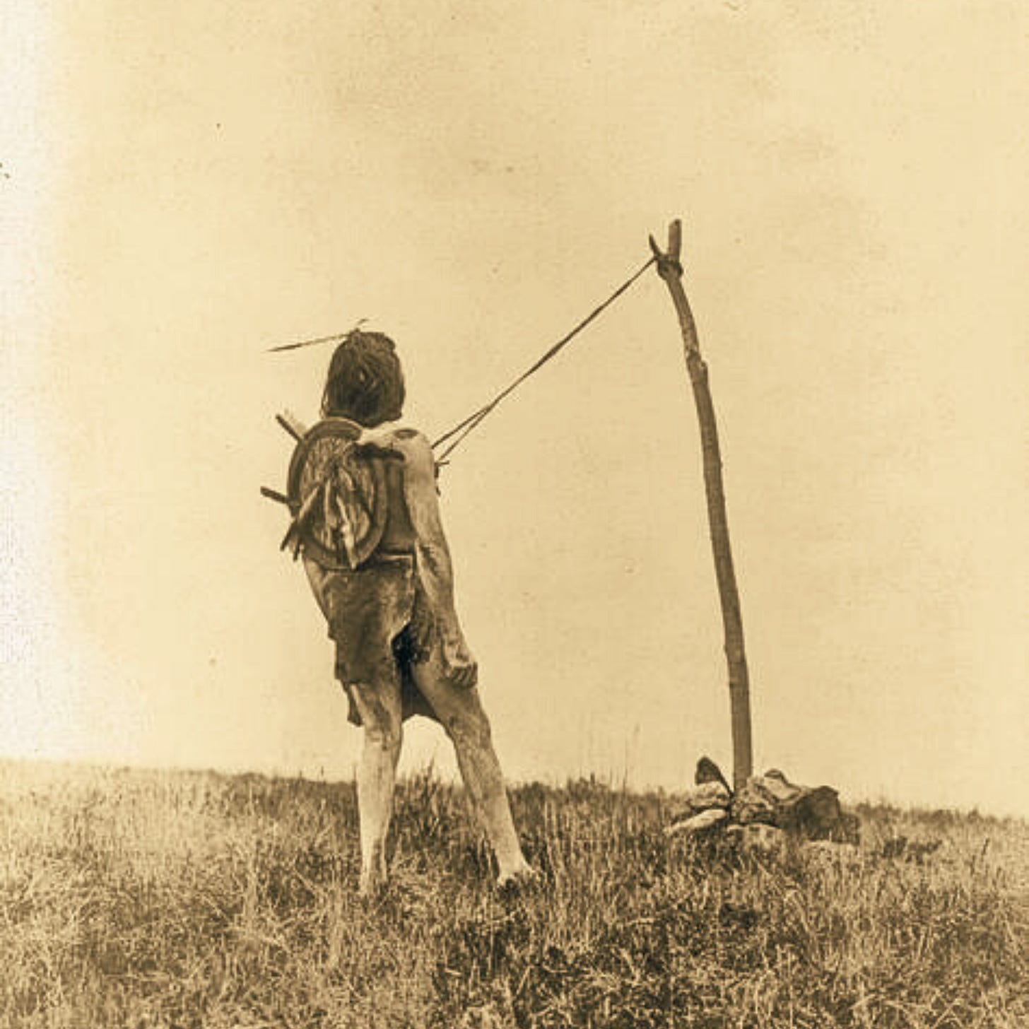 Crow warrior performing Sun Dance.