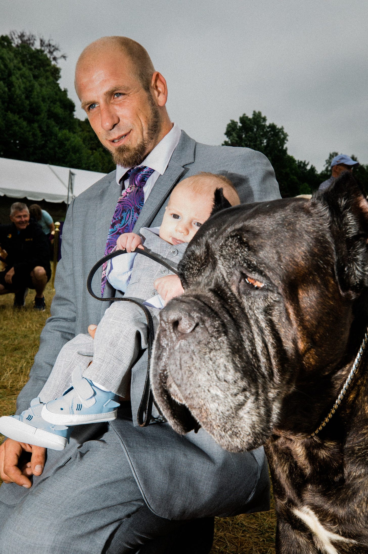 Image may contain Human Person Tie Accessories Accessory Clothing Apparel Animal Dog Mammal Pet and Canine