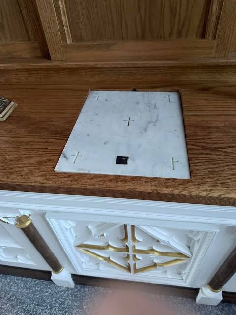 What is an altar stone with a relic and translation of embedded text?
