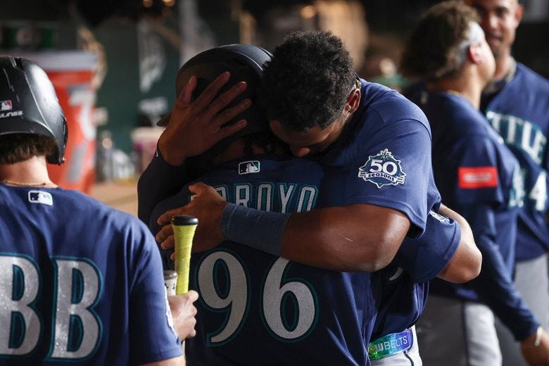 The Mariners’ Lazaro Montes, right, hugs Michael Arroyo after Arroyo’s first major-league hit during the fourth inning against the Athletics on Saturday in West Sacramento, Calif. (Sara Nevis / AP) The Mariners’ Lazaro Montes, right, hugs Michael Arroyo after Arroyo’s first major-league hit during the fourth inning against the Athletics on Saturday in West Sacramento, Calif. (Sara Nevis / AP)
