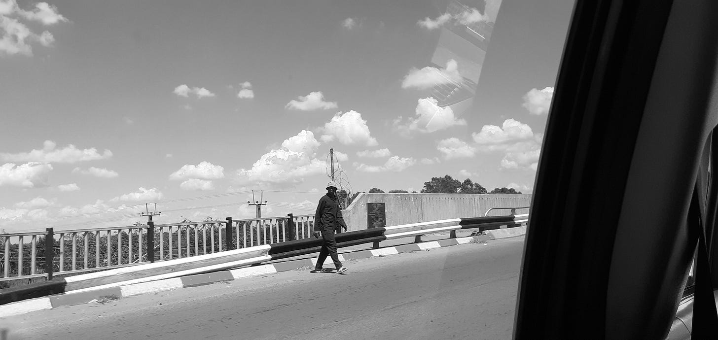A photo of a man crossing a bridge in the west of Gauteng, South Africa. A photo of a man crossing a bridge in the west of Gauteng, South Africa.