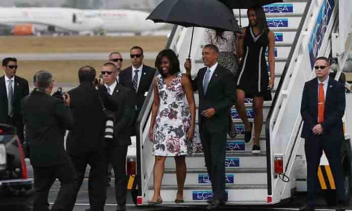 President Barack Obama and his family walk down the stairs as they arrive in Havana, Cuba. President Barack Obama and his family walk down the stairs as they arrive in Havana, Cuba.
