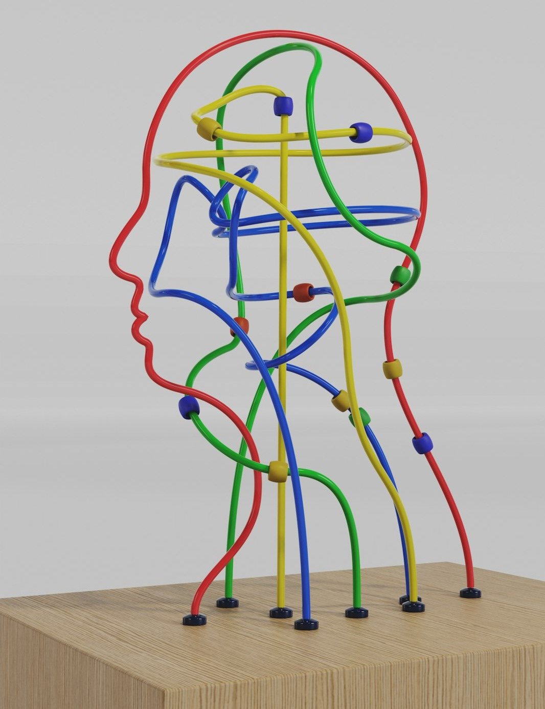 a sculpture of a man's head made of colored wires