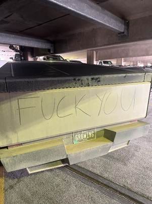 A truck with writing on it

AI-generated content may be incorrect.