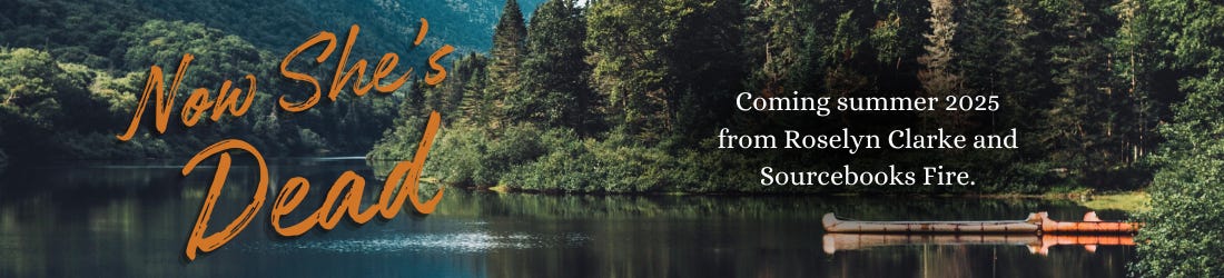 a mountain lake background with the words "Now She's Dead" in large, burnt orange script. Aligned right text reads, "Coming summer 2025 from Roselyn Clarke and Sourcebooks Fire"