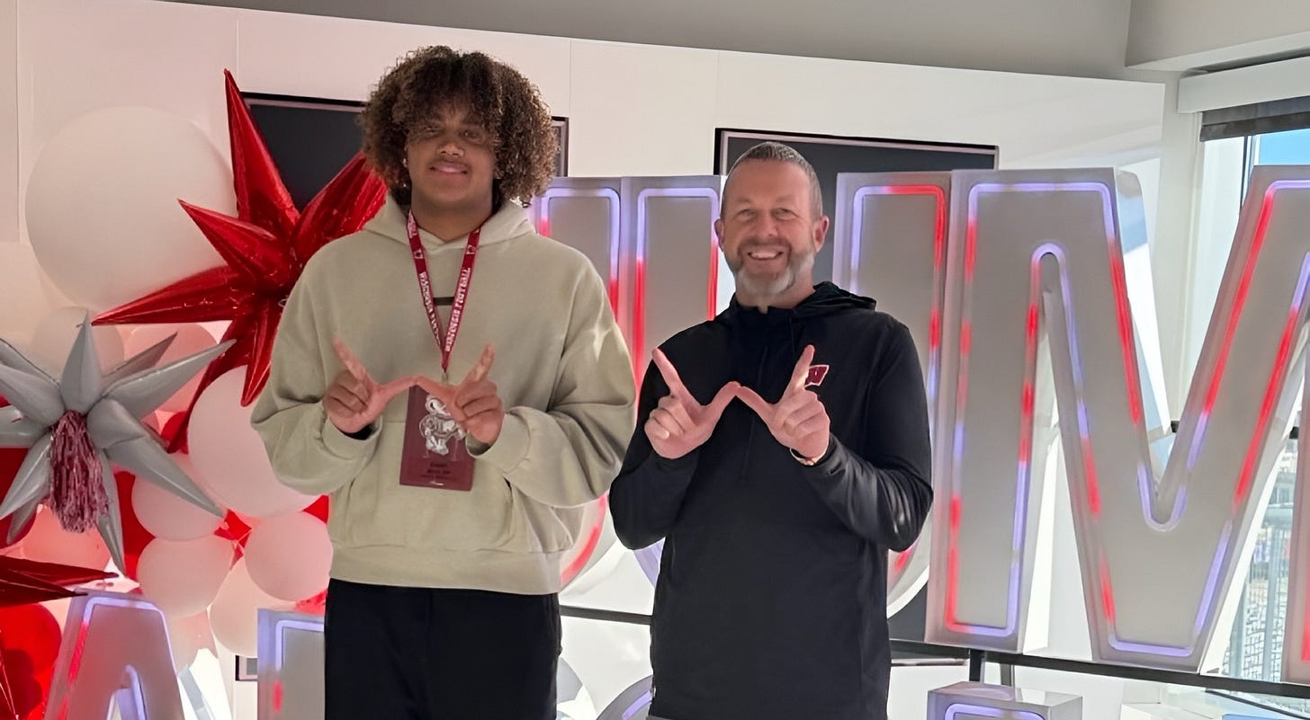 Wisconsin Badgers 2027 EDGE commit Isaac Miller standing next to outside linebackers coach Matt Mitchell