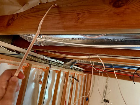 Photos of open walls that show where cables and other electrical wires run.