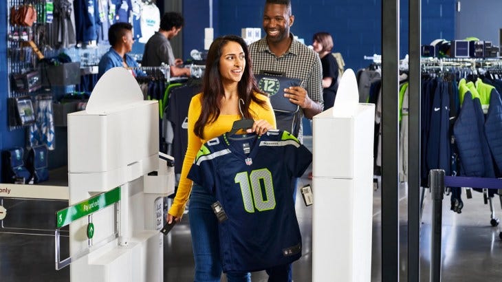 Fans buying football jerseys using Amazon's new Just Walk Out cashierless checkout system Fans buying football jerseys using Amazon's new Just Walk Out cashierless checkout system