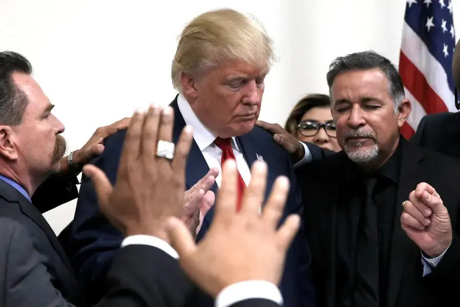 Former U.S. president Donald Trump prays with pastors during a campaign visit to the International Church of Las Vegas and the International Christian Academy in Las Vegas, Nevada, U.S., October 5, 2016. Former U.S. president Donald Trump prays with pastors during a campaign visit to the International Church of Las Vegas and the International Christian Academy in Las Vegas, Nevada, U.S., October 5, 2016.