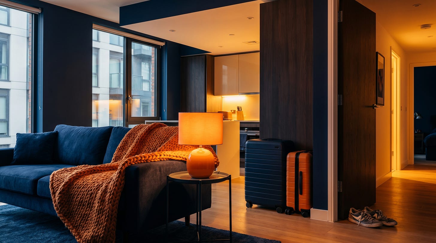 A warm, occupied short-term rental with luggage by the door A warm, occupied short-term rental with luggage by the door