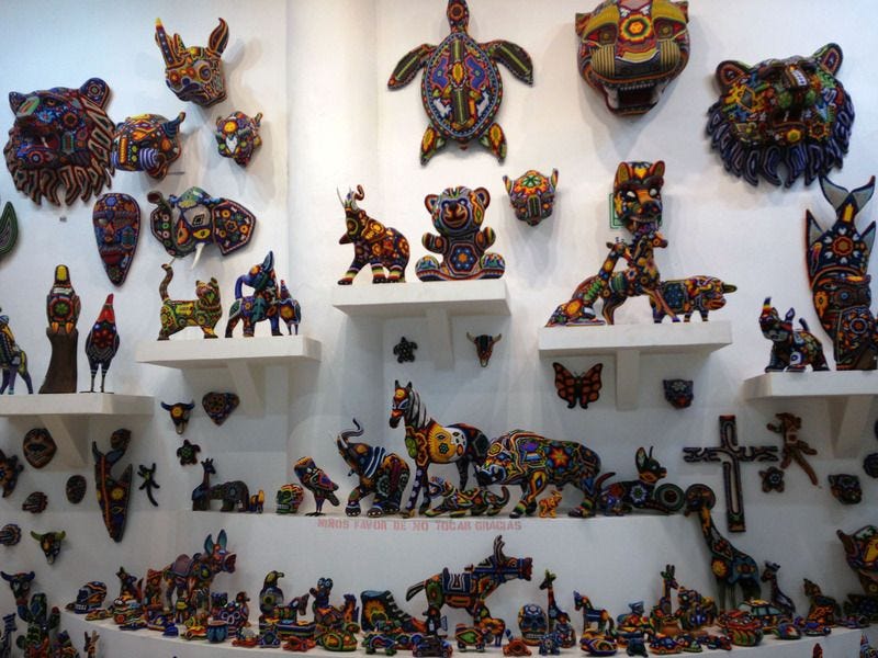 Tierra Huichol beaded art Mexican souvenirs Playa del Carmen Cancun Mexico beadwork Riviera Maya Tierra Huichol beaded art Mexican souvenirs Playa del Carmen Cancun Mexico beadwork Riviera Maya
