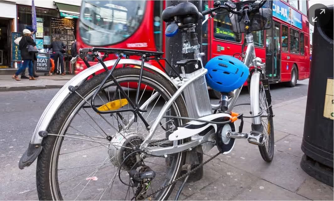 May be an image of 3 people, parking meter, bicycle, street and text that says "BOAT TRIPS TODAY"