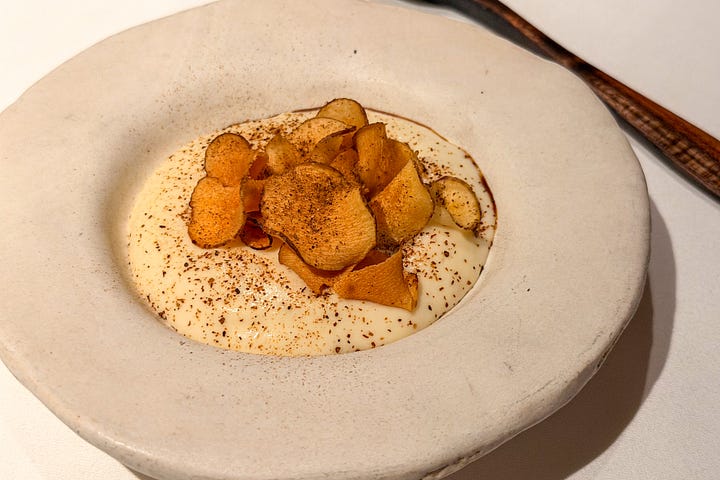 Orkney scallops in chicken jus, Jerusalem artichokes and cep powder at Osip.