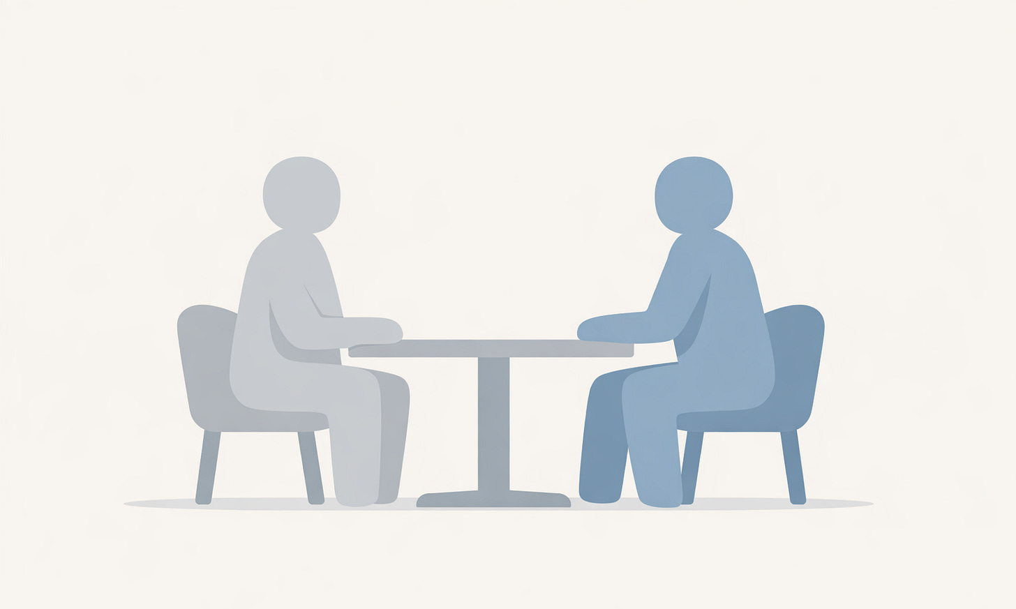 Two People Sitting at A Desk