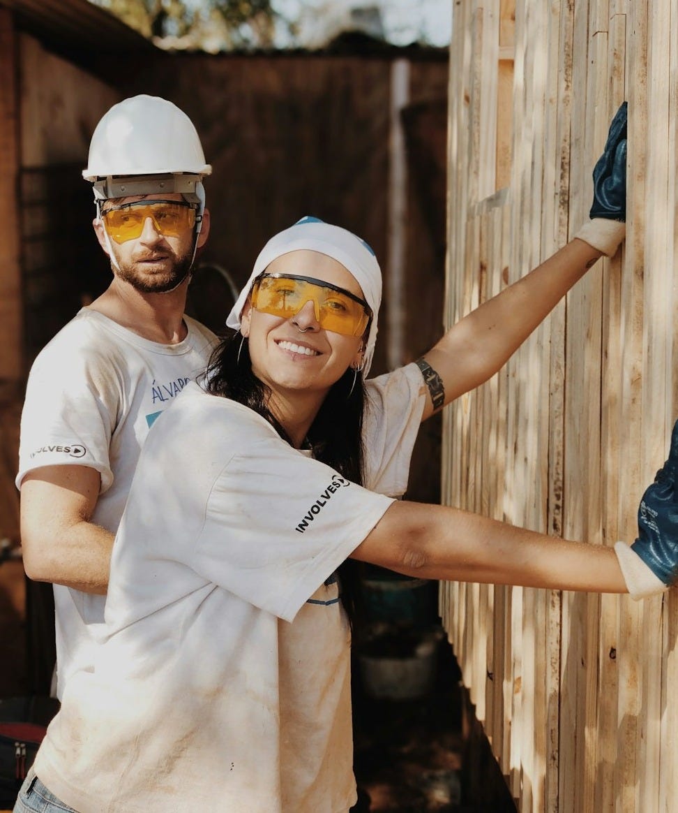 woman in white shirt wearing white helmet