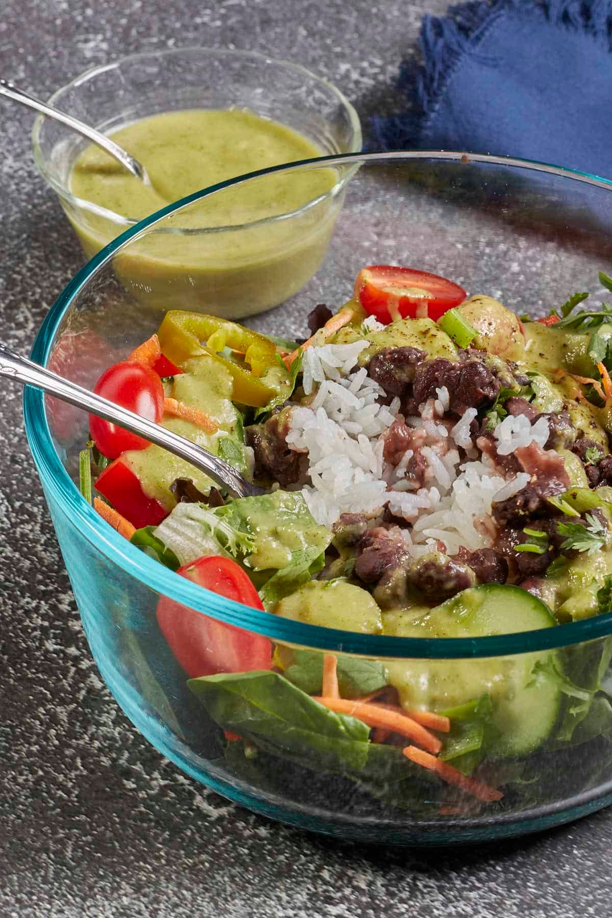 Salad with rice, beans, and this green Chile lime salad dressing