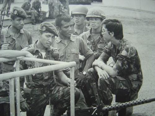 A group of men in military uniforms

Description automatically generated