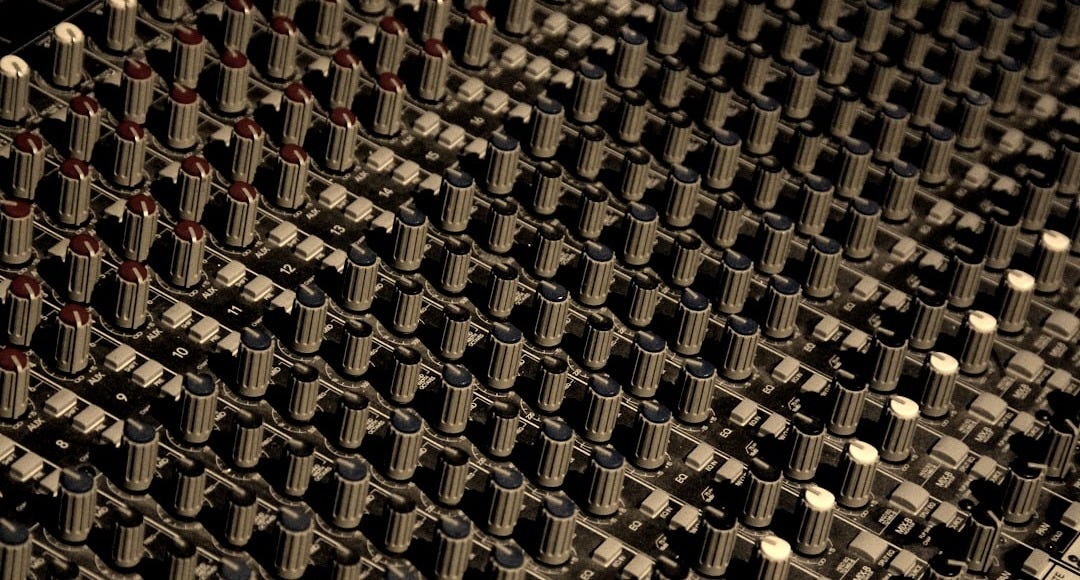 gray and blue DJ mixer