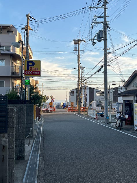 3 photos, one of a level crossing with sea beyond, one showing the Chimori River appearing from under the railway tracks, and one of the Chimori River flowing into Osaka Bay