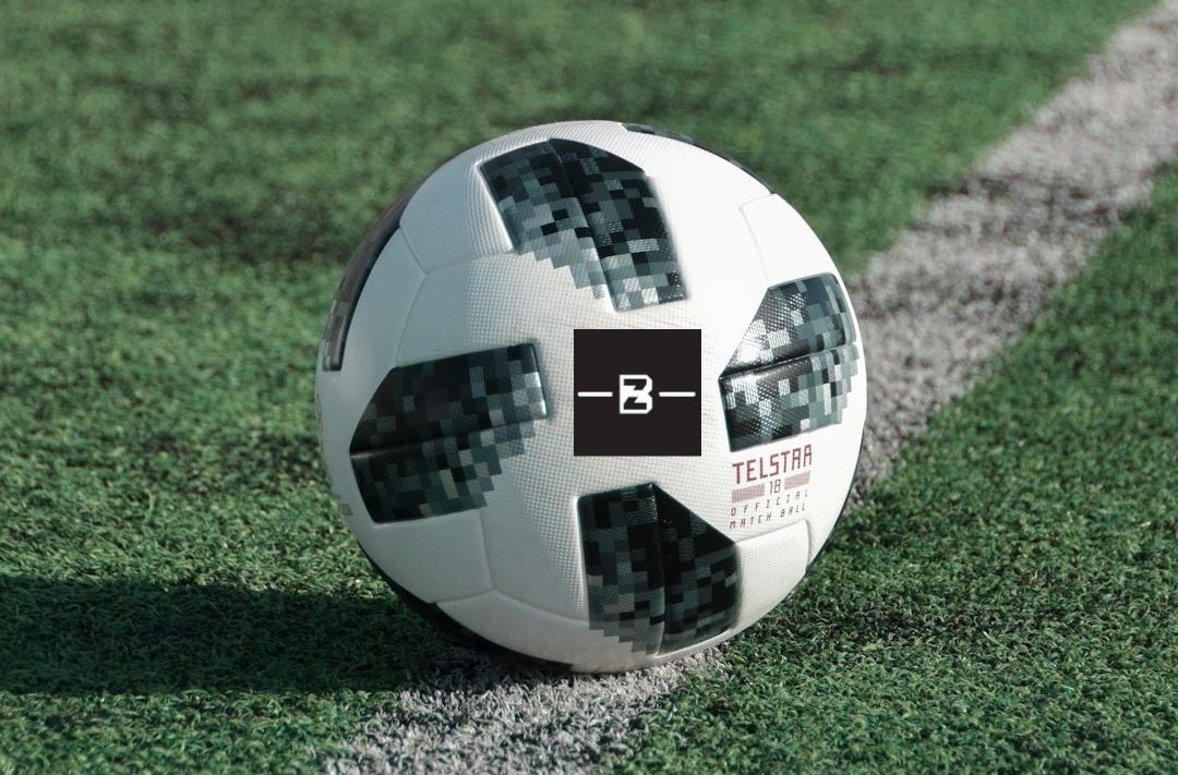 close-up photography of adidas soccer ball on field close-up photography of adidas soccer ball on field