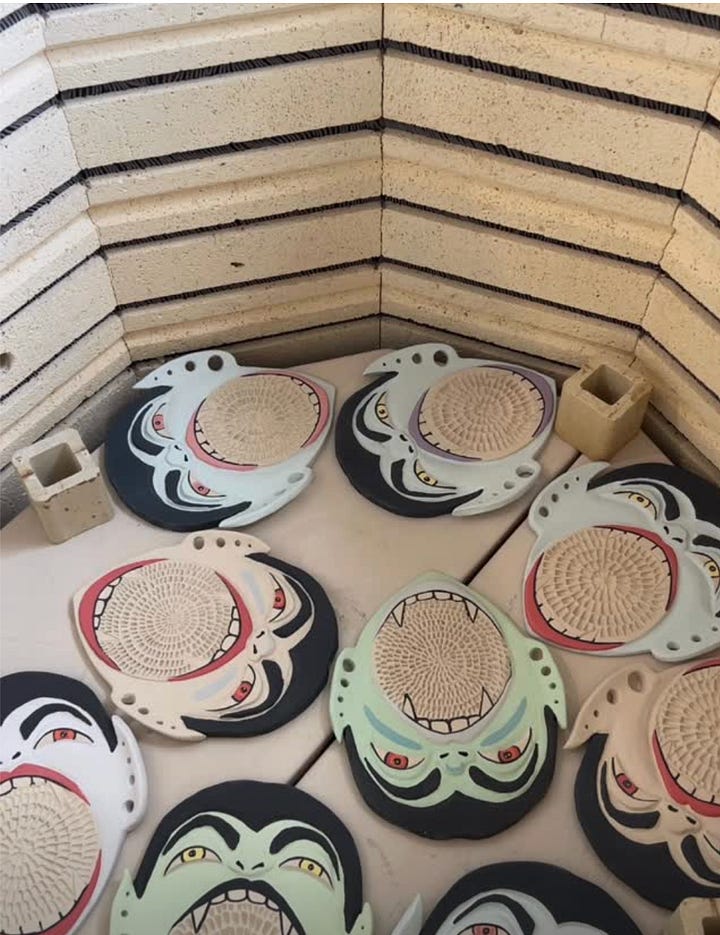 First photo: vampire shaped garlic graters in a kiln.  Second photo: a collage of a cat peeking through leaves.