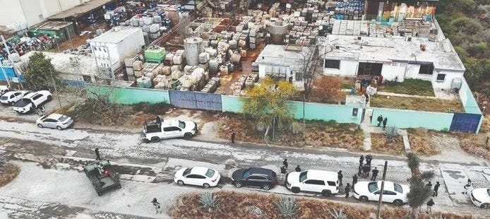 A large amount of chemical containers can be seen from the air. This cartel lab occupied an entire block of an industrial neighborhood. A large amount of chemical containers can be seen from the air. This cartel lab occupied an entire block of an industrial neighborhood.