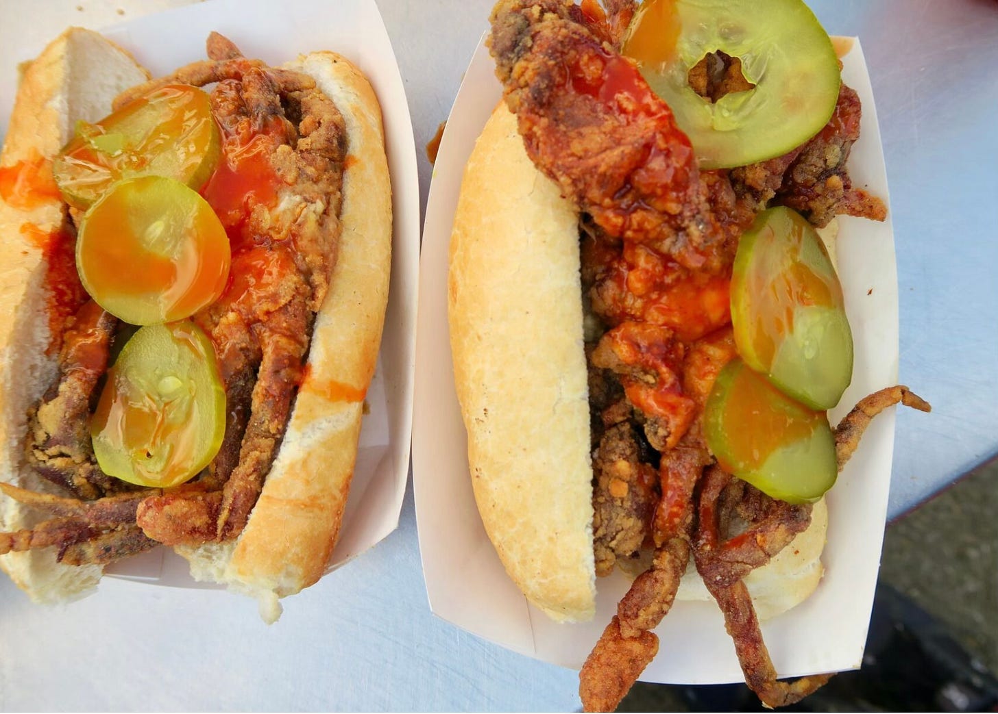 fried softshell crab po'boys with pickles and hot sauce fried softshell crab po'boys with pickles and hot sauce