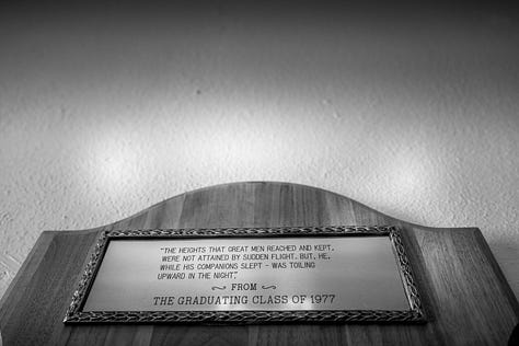 scenes from around campus including a dedication from the Class of 1977, a poem about the alma mater, historical markers, and images of historical hallway in admin building