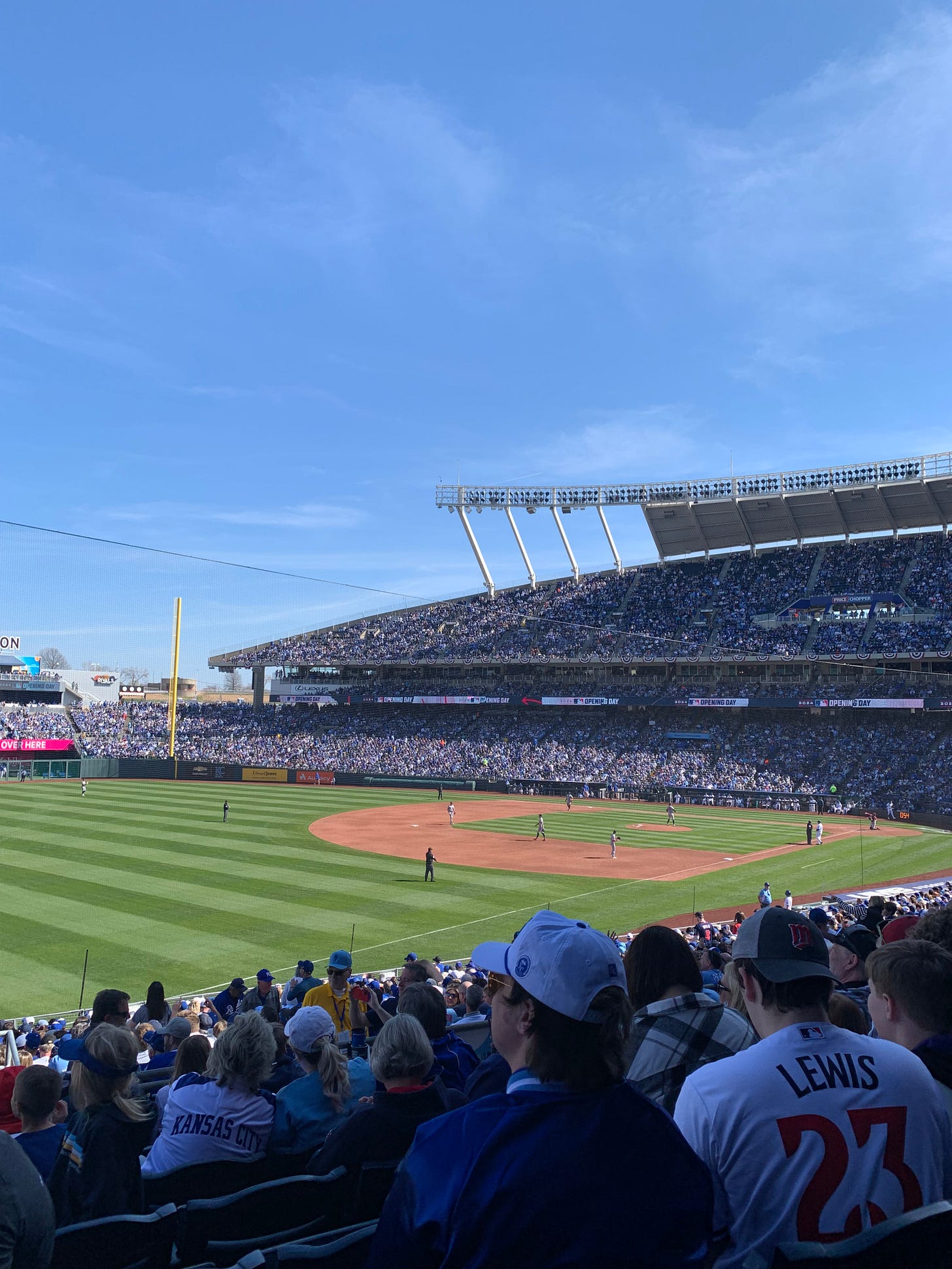 view of a baseball game in a stadium crowded with fans