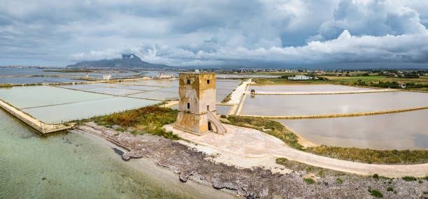 torre nubia saline di trapani ancient saltworks tower panorama sicily italy - marsala sicily stock pictures, royalty-free photos & images