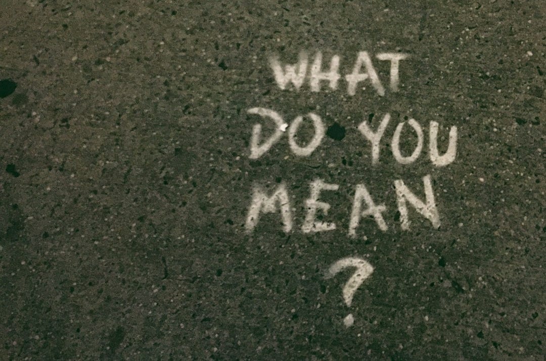 what do you mean? text on gray surface