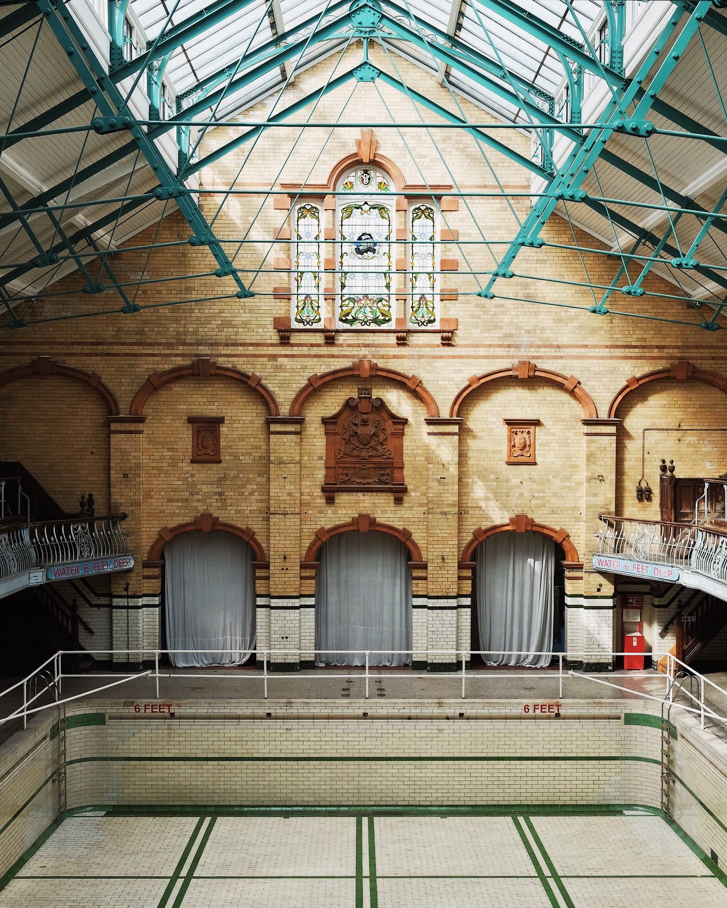 A photo of an empty pool at the Victoria Baths in Manchester, UK A photo of an empty pool at the Victoria Baths in Manchester, UK