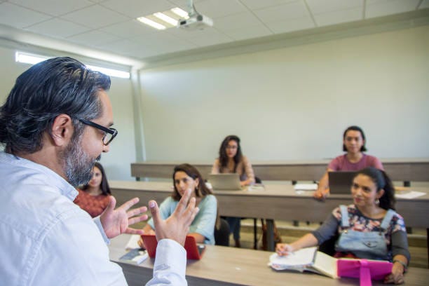 College teacher in class College teacher in class