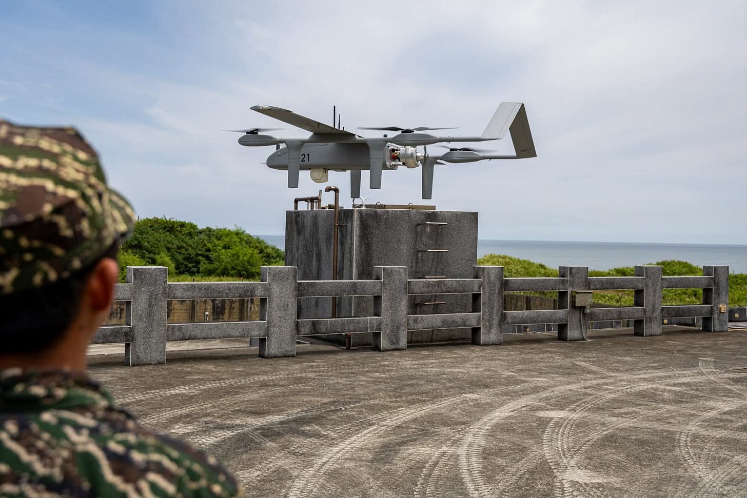 A TU-30VG unmanned aerial vehicle displayed by Taiwan’s Littoral Defense Command overlooking the coastline, representing the growing role of unmanned systems in coastal defense.