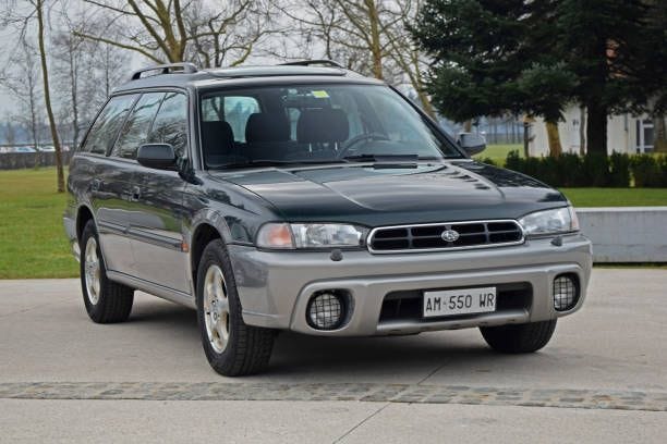 classic subaru outback on the street - old subaru stock pictures, royalty-free photos & images