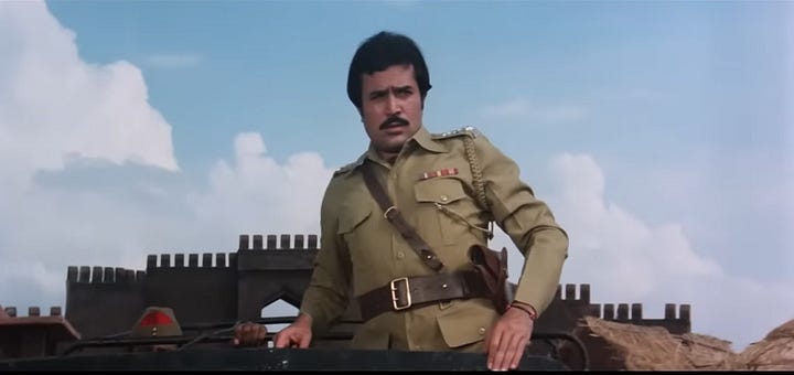snapshot from the movie Rajput where the rebel dacoits are seen surrendering their guns to the police
