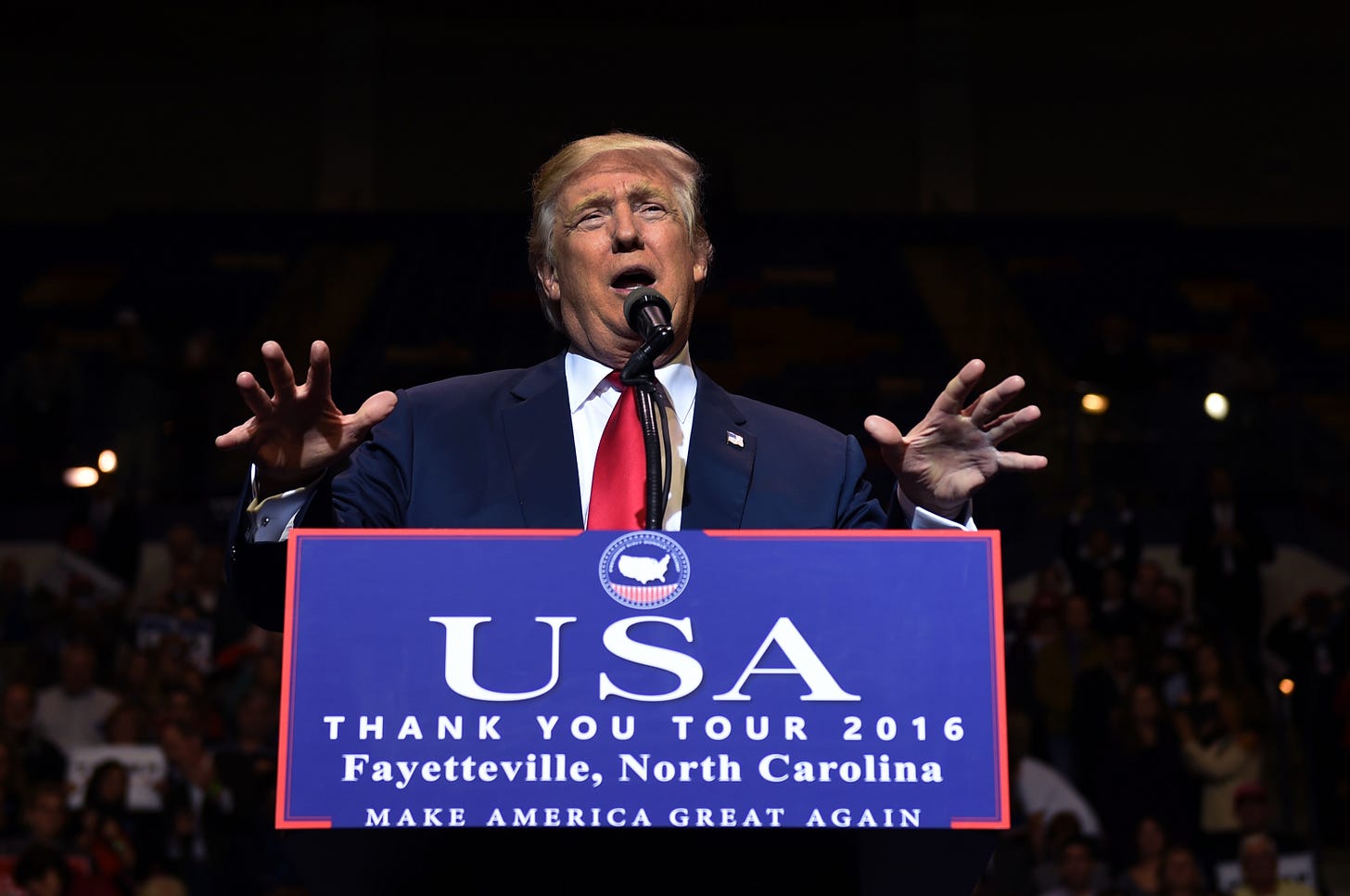 US President-elect Donald Trump speaks at the Crown Coliseum in Fayetteville, North Carolina on December 6, 2016. (Photo by Timothy A. Clary/AFP via Getty Images). US President-elect Donald Trump speaks at the Crown Coliseum in Fayetteville, North Carolina on December 6, 2016. (Photo by Timothy A. Clary/AFP via Getty Images).